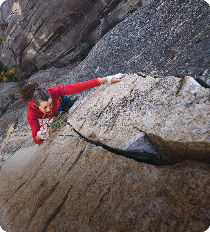 MHW climber Miranda Oakley reaches for her next hold while lead climbing in Yosemite valley.
