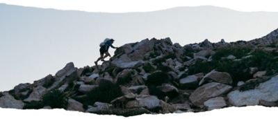 MHW Athlete Ted Hesser trail running in the high alpine.
