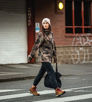 Two people jumping into a river. 