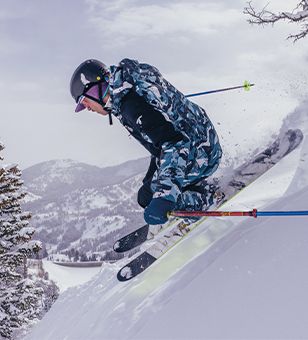 A man running on a dusty trail. 