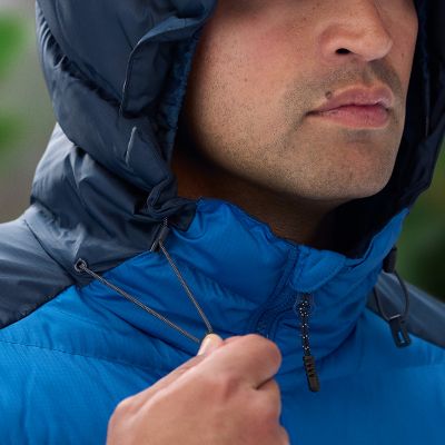 Model adjusting the hood fully over their head.