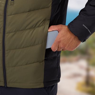 Model putting phone in a hand pocket.