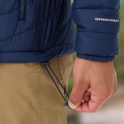 Model tightening the drawcord that adjusts the hem