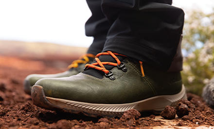 A man in a hiking shoe with TechLite Live cushioning.
