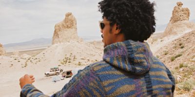 Camping in the desert wearing the HiCamp Fleece Hoody.