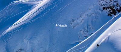 A skier in powdery backcountry. Columbia Titanium.