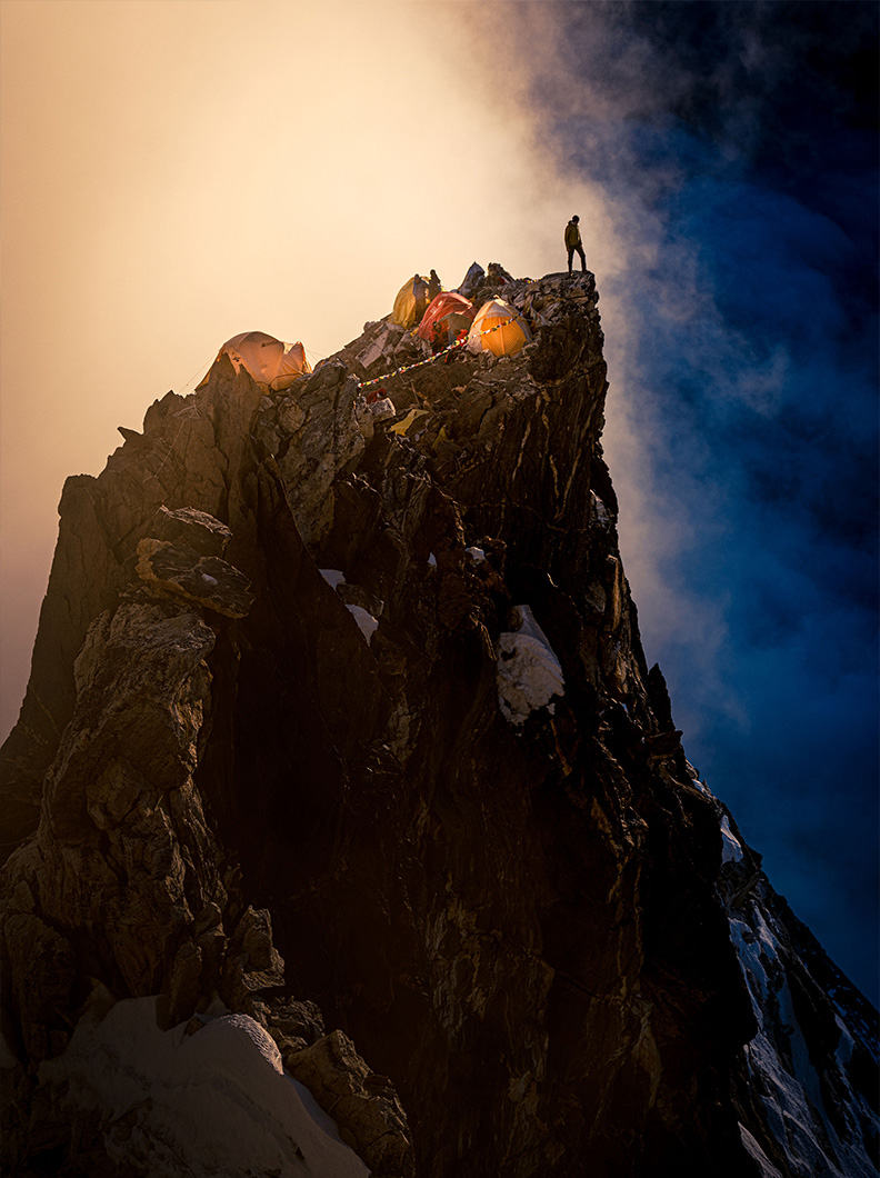 Epic shot that Ted took of a tiny mountaineer on a cliff near base camp in the high alpine.