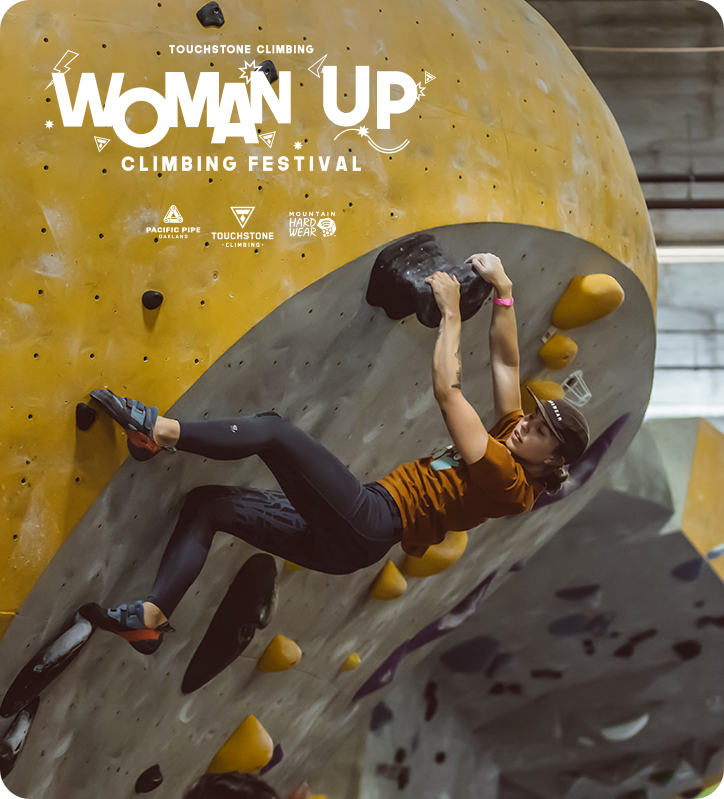 From the 2019 Woman Up event, a climber pulls up on the wall