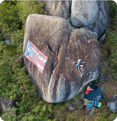 Aerial shot of Kyra Condie climbing in Puerto Rico.