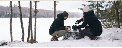 Building a fire in a very snowy Canada landscape