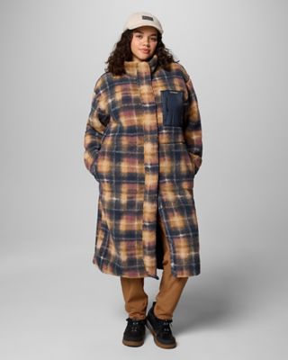 A stylish woman in a super cute, long fleece jacket.
