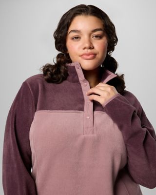A woman in a cozy blue fleece with the hood up.