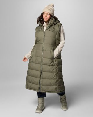 Woman in a long green puffer vest.