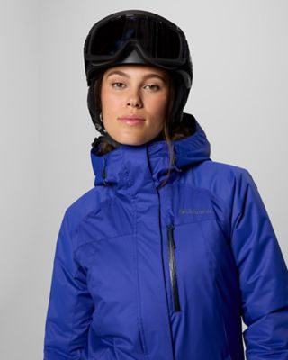 A woman in a head to toe ski outfit.