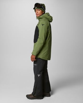 A man in a green ski jacket.