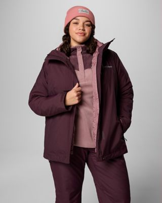 A woman in a casual looking ski outfit.