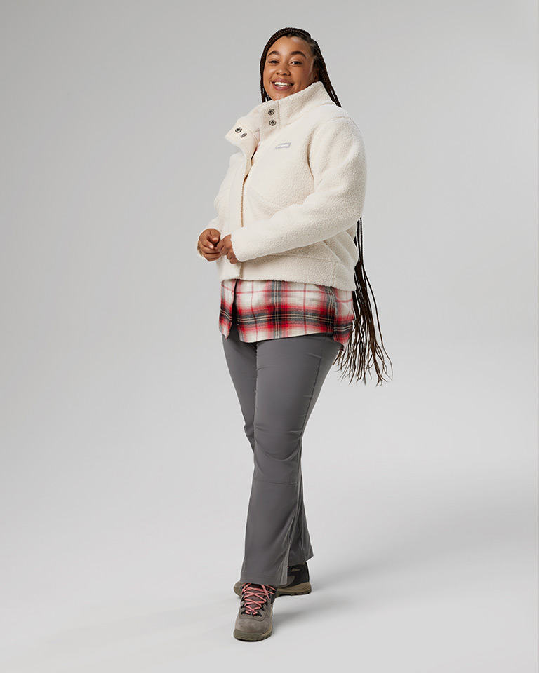 Outfit 1: nubby sherpa fleece jacket in white, red and white plaid shirt, gray pants, tan hiking boots.