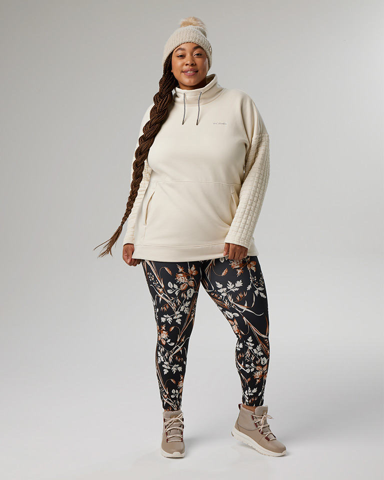 Outfit 3: knit pom pom beanie, white hoodie, and floral print leggings.