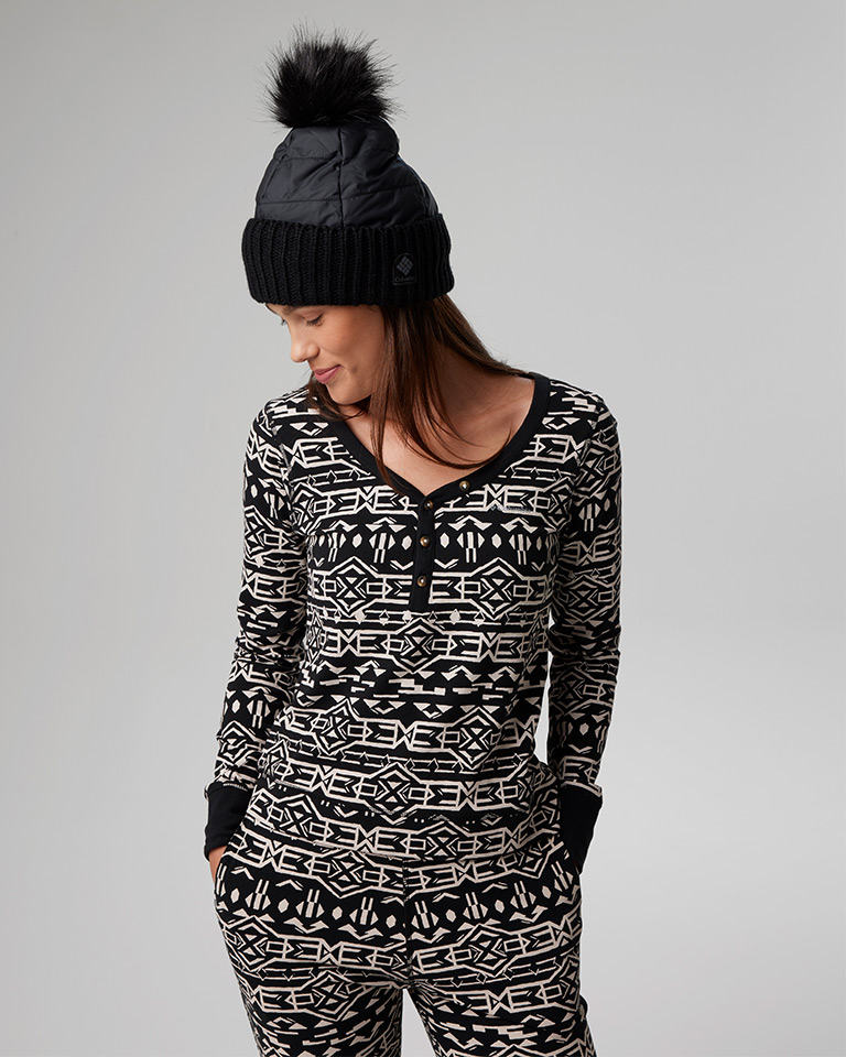 Outfit 5: black and white printed top and bottom with a black knit pom pom beanie.
