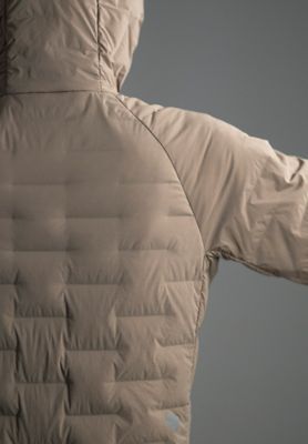 Detail shot of the Women's Super/DS™ Stretchdown Parka in the studio being actively stretched out