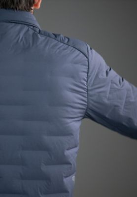 Detail shot of the Men's Super/DS™ Stretchdown Climb Shacket in the studio being actively stretched out