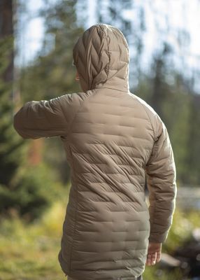 Charlotte Durif  turned around and stretching, while wearing the Women's Super/DS™ Stretchdown Parka outside of Salt Lake City

