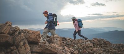 MHW ambassadors, Genevive Walker and Cody Kaemmerlen hike outside of Salt Lake City, both wearing the Super/DS™ Stretchdown Hooded Jacket.