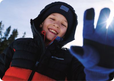 A kid out exploring in bestselling Columbia gear.