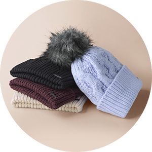 A laydown image of colorful beanies.