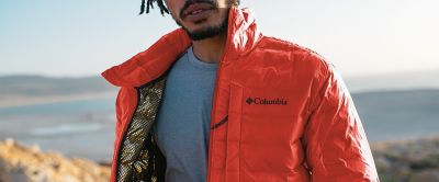 Man wearing an orange Omni Heat Infiniti jacket. 