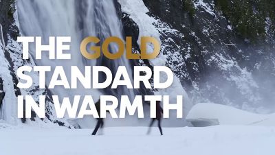 Video of two hikers in a winter wonderland by a waterfall in their Omni Heat Infinity jackets.