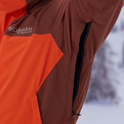 Close-up of a woman buttoning a Silver Ridge shirt. 