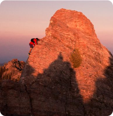 Shot of Ted Hesser trail running during sunset.