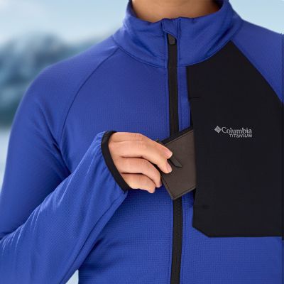 Close-up of a model putting a wallet in the chest pocket.
