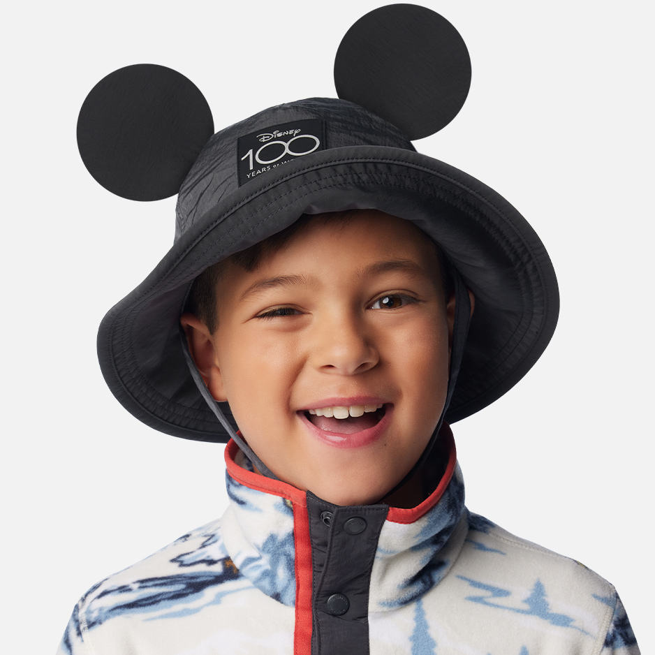 A child in a Disney 100 bucket hat. 
