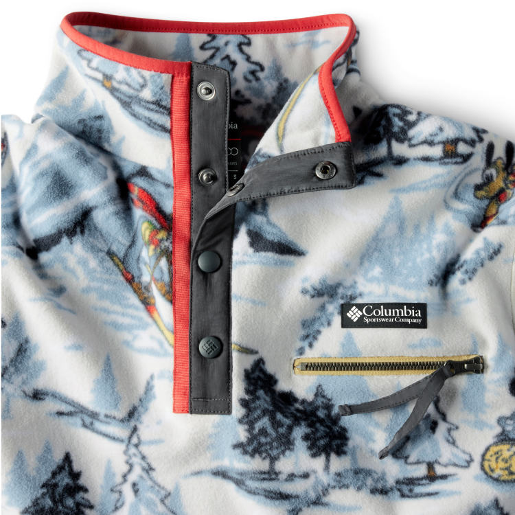 Close-up of fleece print, half-snap closure and zip pocket. 