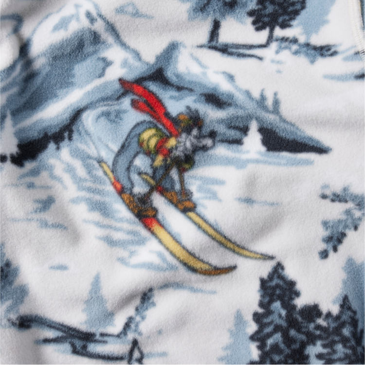 Close-up of fleece print featuring Goofy skiing. 