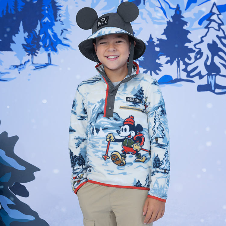 A kid in the Disney 100 fleece. 