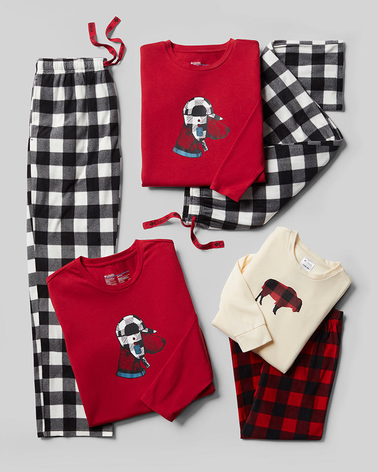 A laydown college of holiday-themed family pajamas.