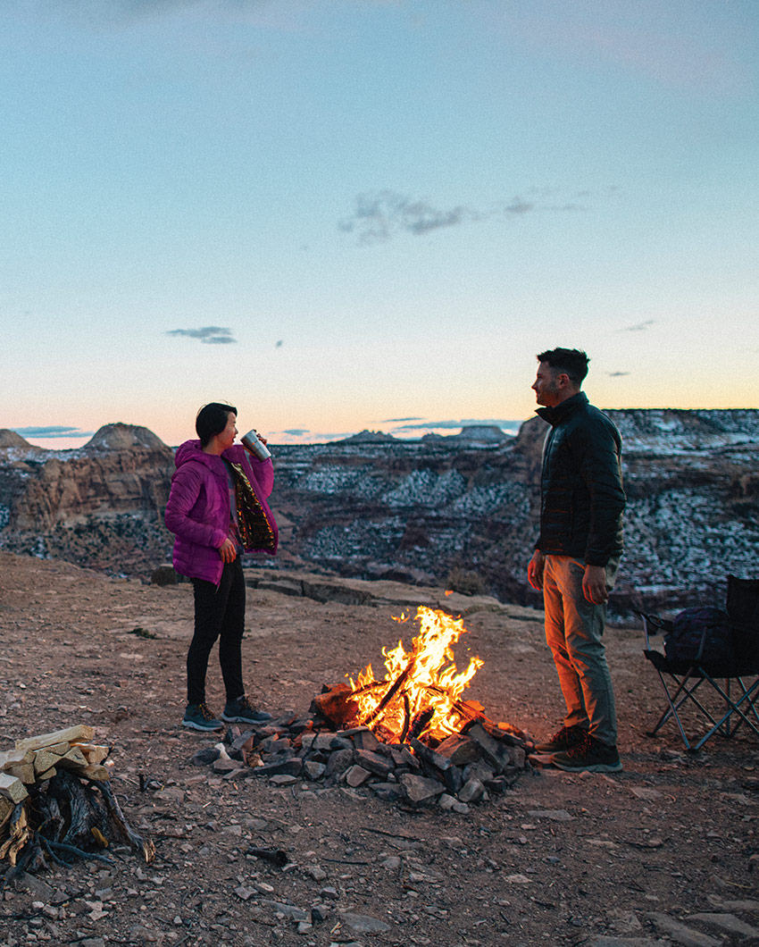 A couple enjoying a campfire.