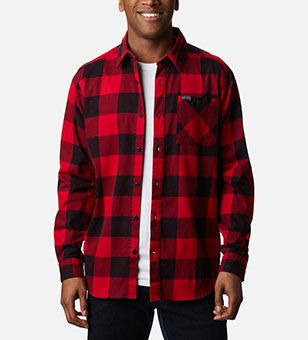 A man in a long sleeve flannel top.