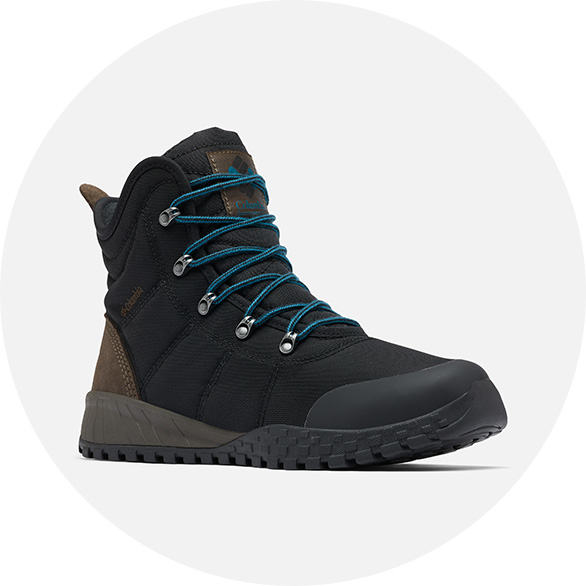 Close-up of a black  hiking boot for men. 