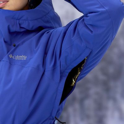 Model lifting up their arm to reveal the zippered, breathable underarm vents.