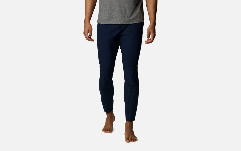 A product image of a man wearing Columbia Sportswear’s Bliss Ascent Hybrid Pants against a white background. 