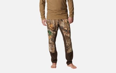 A product image of a woman wearing Columbia Sportswear’s PHG Tropy Rack Omni-Heat Helix Fleece Pants against a white background.  

​ 