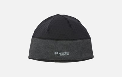 A product image of a man wearing Columbia Sportswear’s Sweat-Wicking Beanie against a white background. 