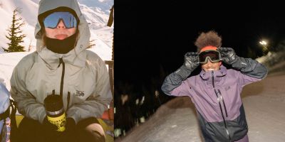 Two skiiers side by side all smiles.