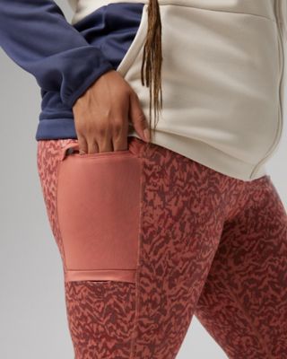 Outfit 4: white hoodie, coral pink printed leggings, tan boots.
