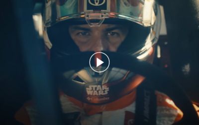 Video still of Bubba Wallace behind the wheel of the Columbia No. 23 X-wing Toyota. Play button. 