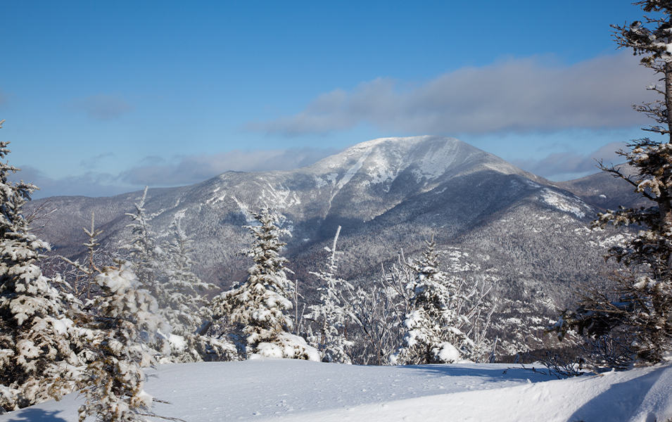The Adirondacks’ Noonmark Summit is just one of many stunning northeastern mountain ranges that get covered in blankets of snow this time of year.